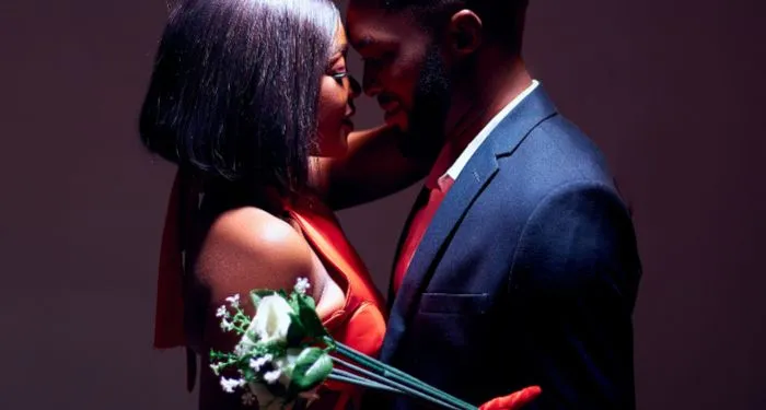 a cis het brown-skinned Black couple canoodling